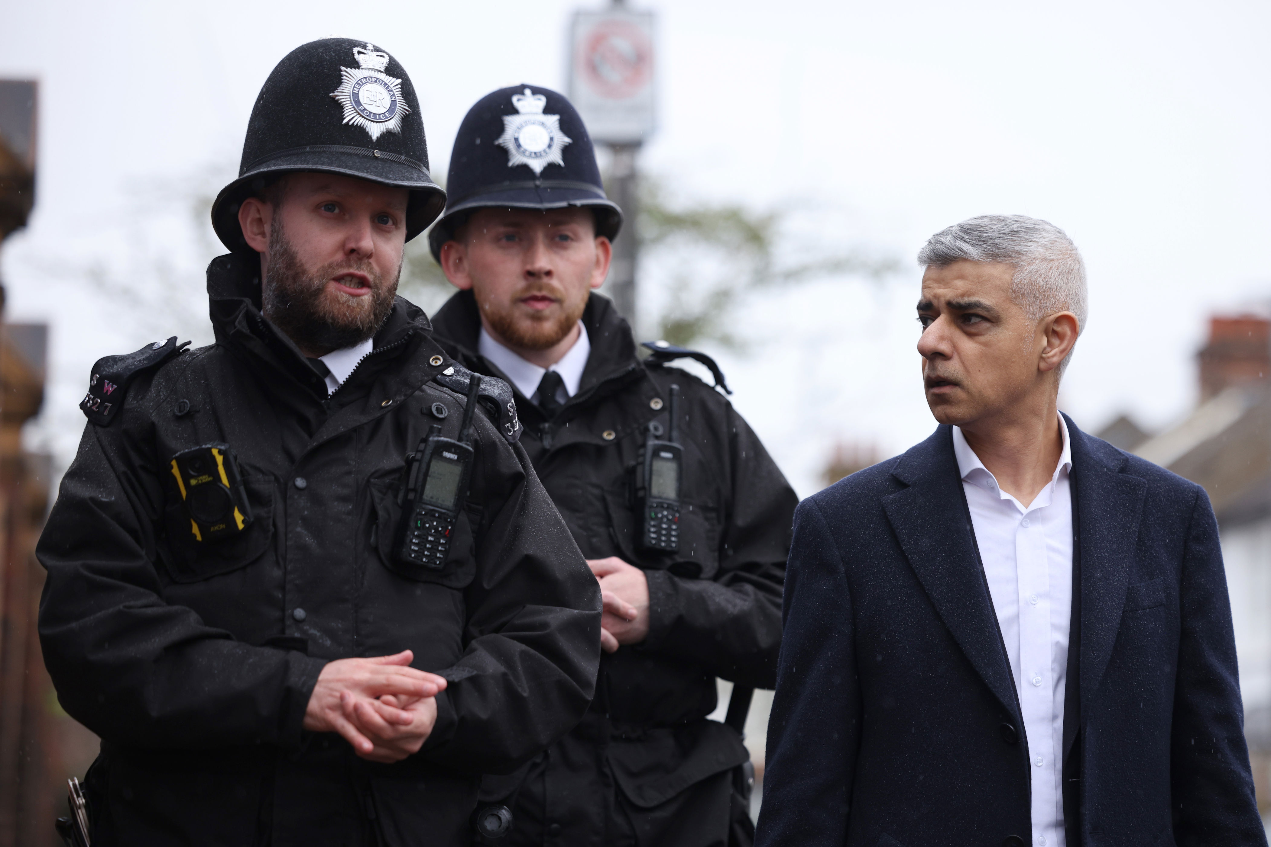 London Mayor Sadiq Khan walks and speaks with police officers in Earlsfield (Getty)