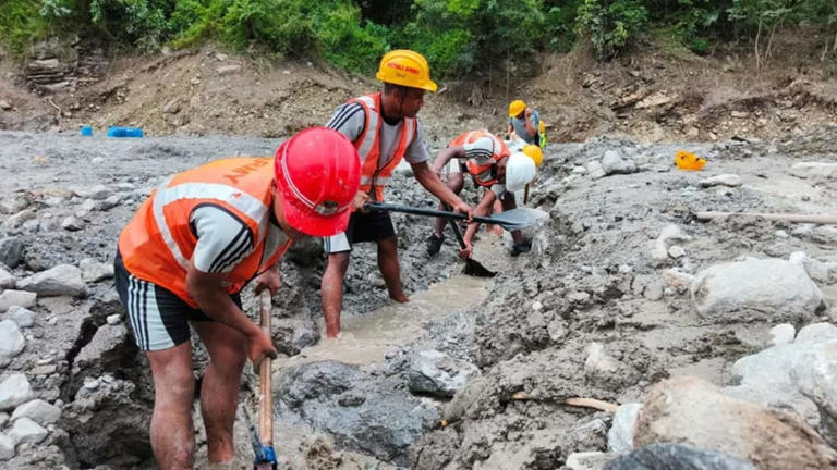 Nepal army soldiers work during a search and rescue operation outside a tunnel near the Hydropower Project sites in Rasuwa district.