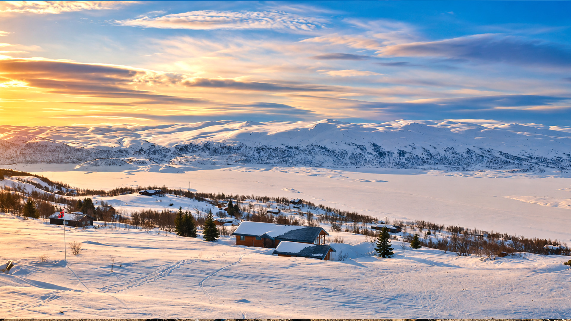 Snow-covered mountains stretching across Norway’s remote wilderness