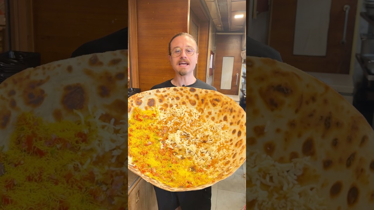 Indian chefs prepare a giant flatbread nearly as big as a person and ...