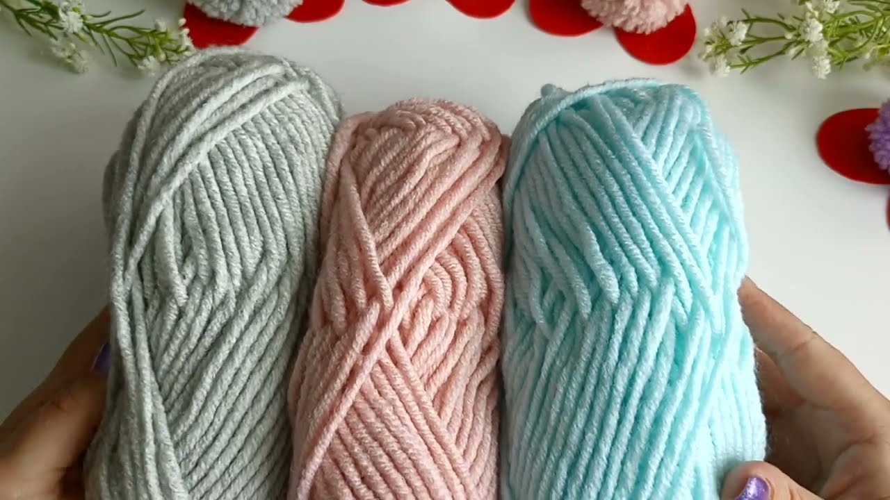 Creating pom pom yarn hearts with simple steps
