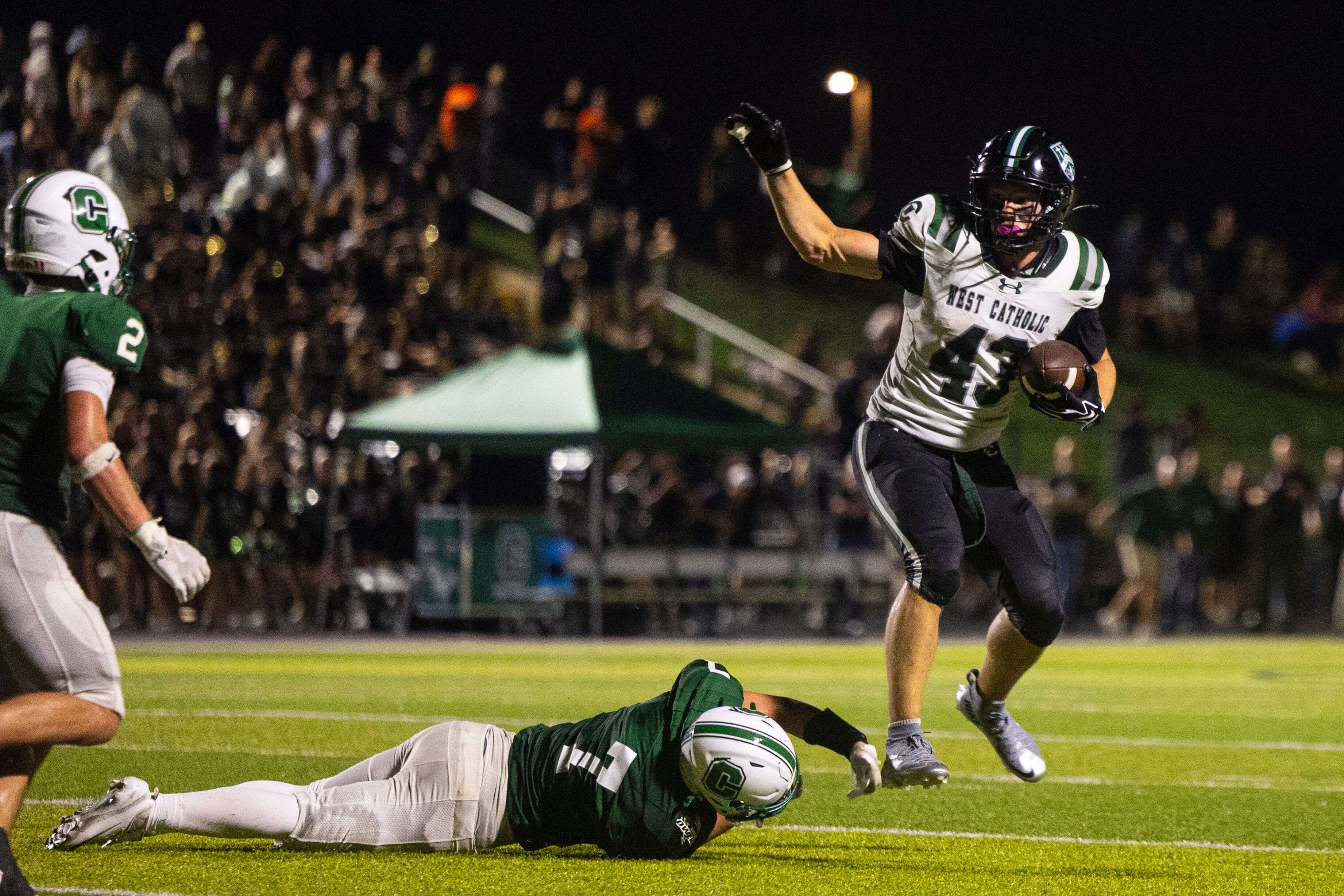 Photos: Coopersville rolls past West Catholic 41-21, snaps 6-game skid to the Falcons