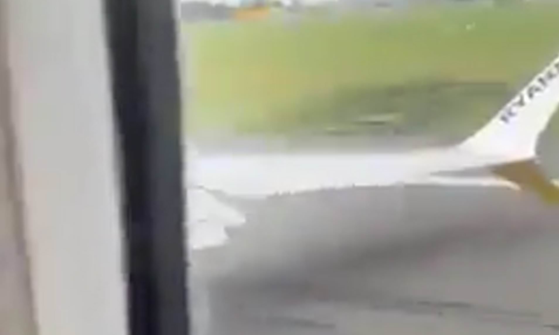 Moment Ryanair passengers scream as Boeing jet's wing clips runway during aborted landing