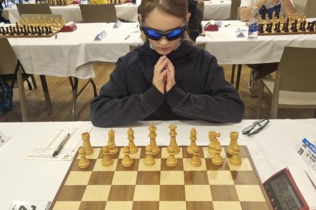 Chess prodigy, 12, crowned British champion after perfect score