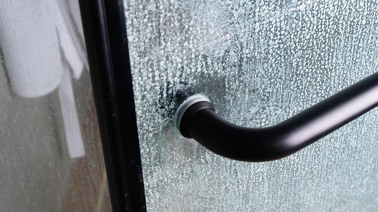 I removed stubborn water stains from my glass shower door — without ...