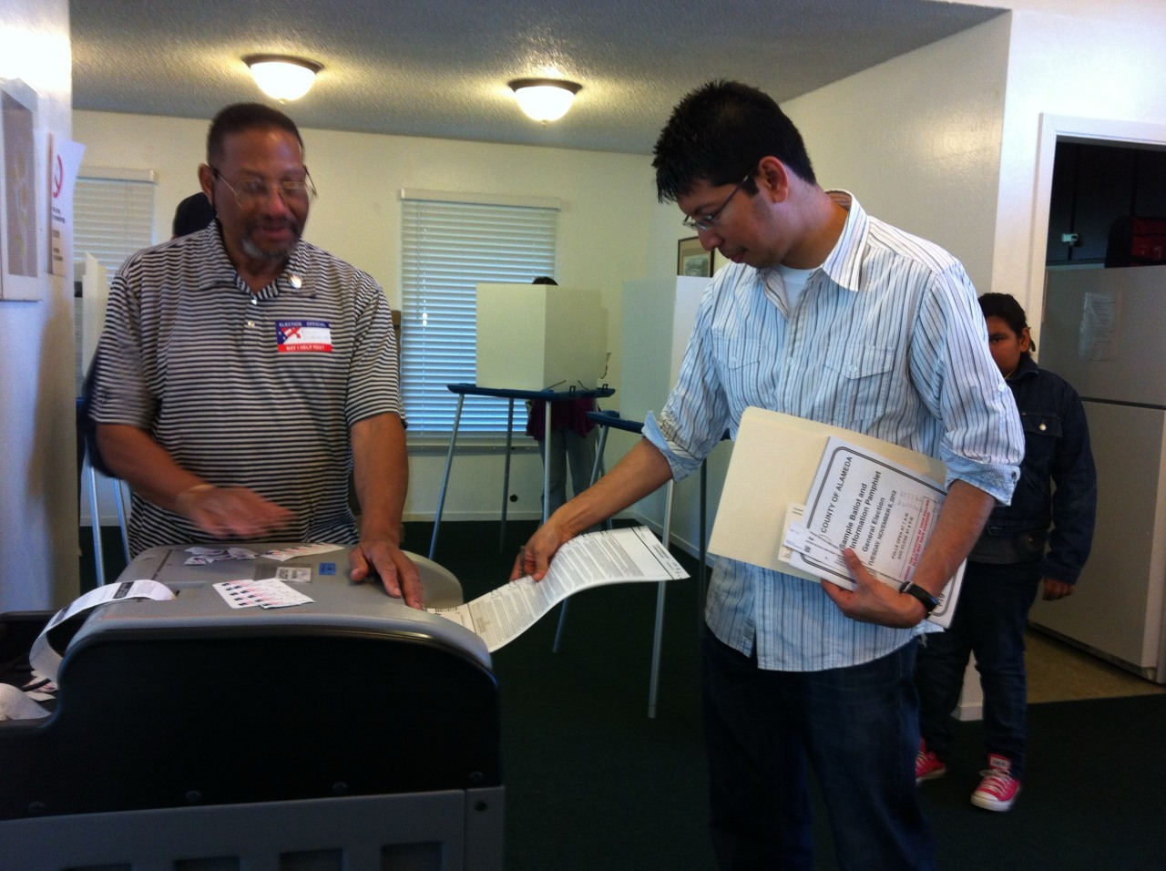 Min Zin, a naturalized American citizen, casts a ballot during the 2012 U.S. general election.
