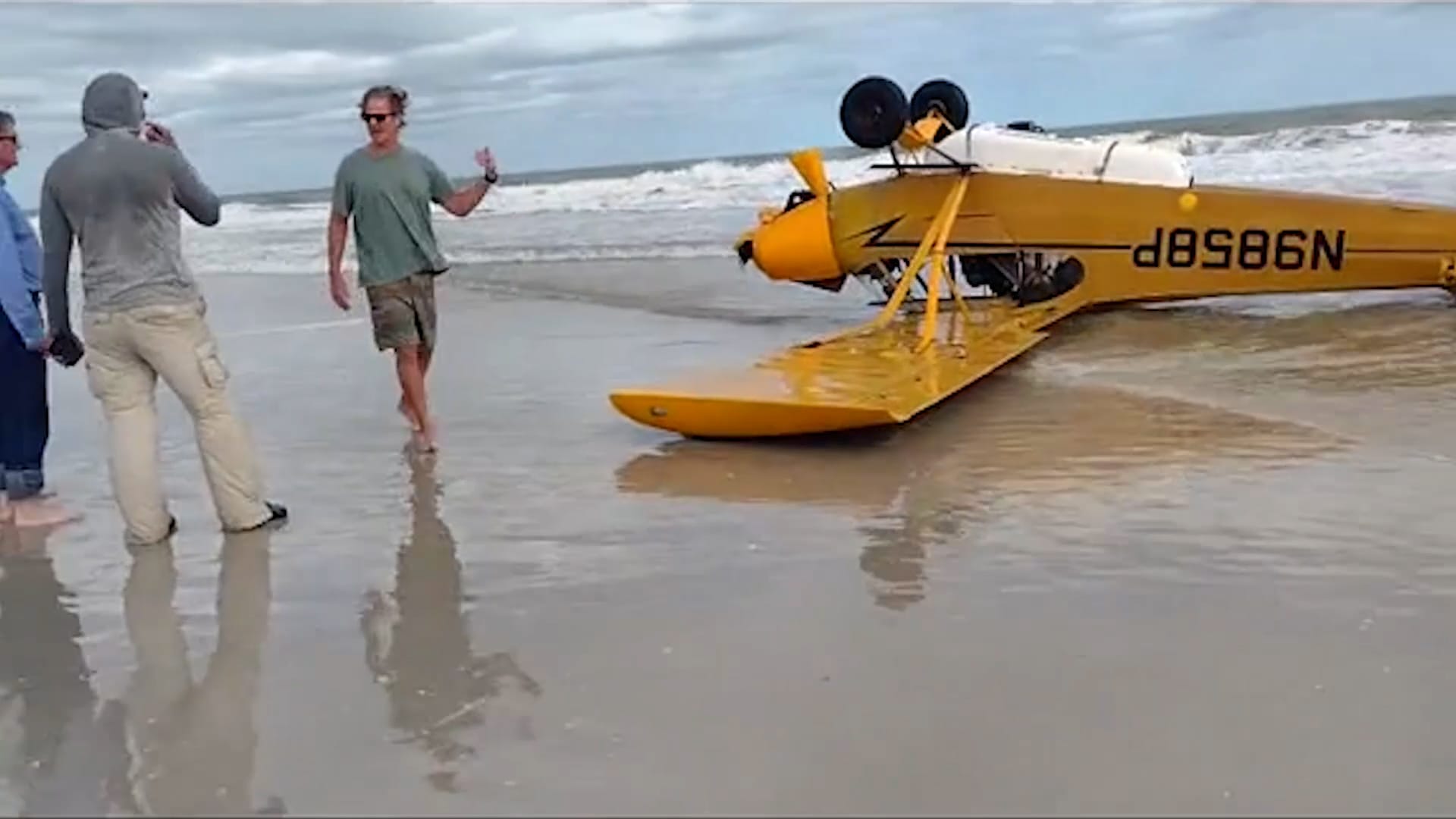 Pilot walks away unscathed after plane crashes upside down on Florida beach