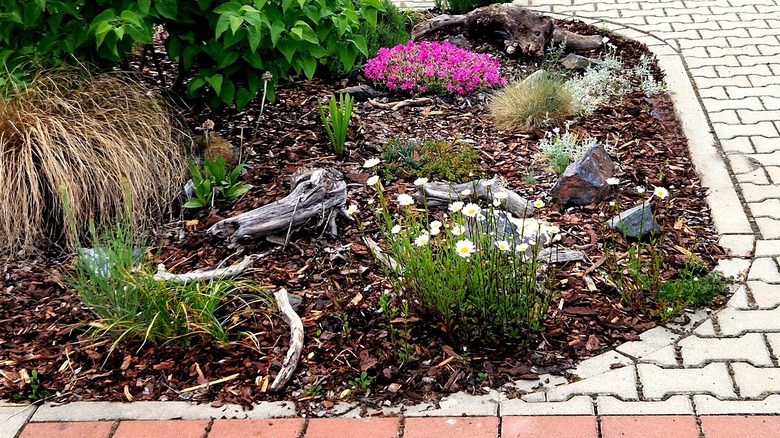 Give mulched garden bed edging a rustic touch with a DIY that uses ...