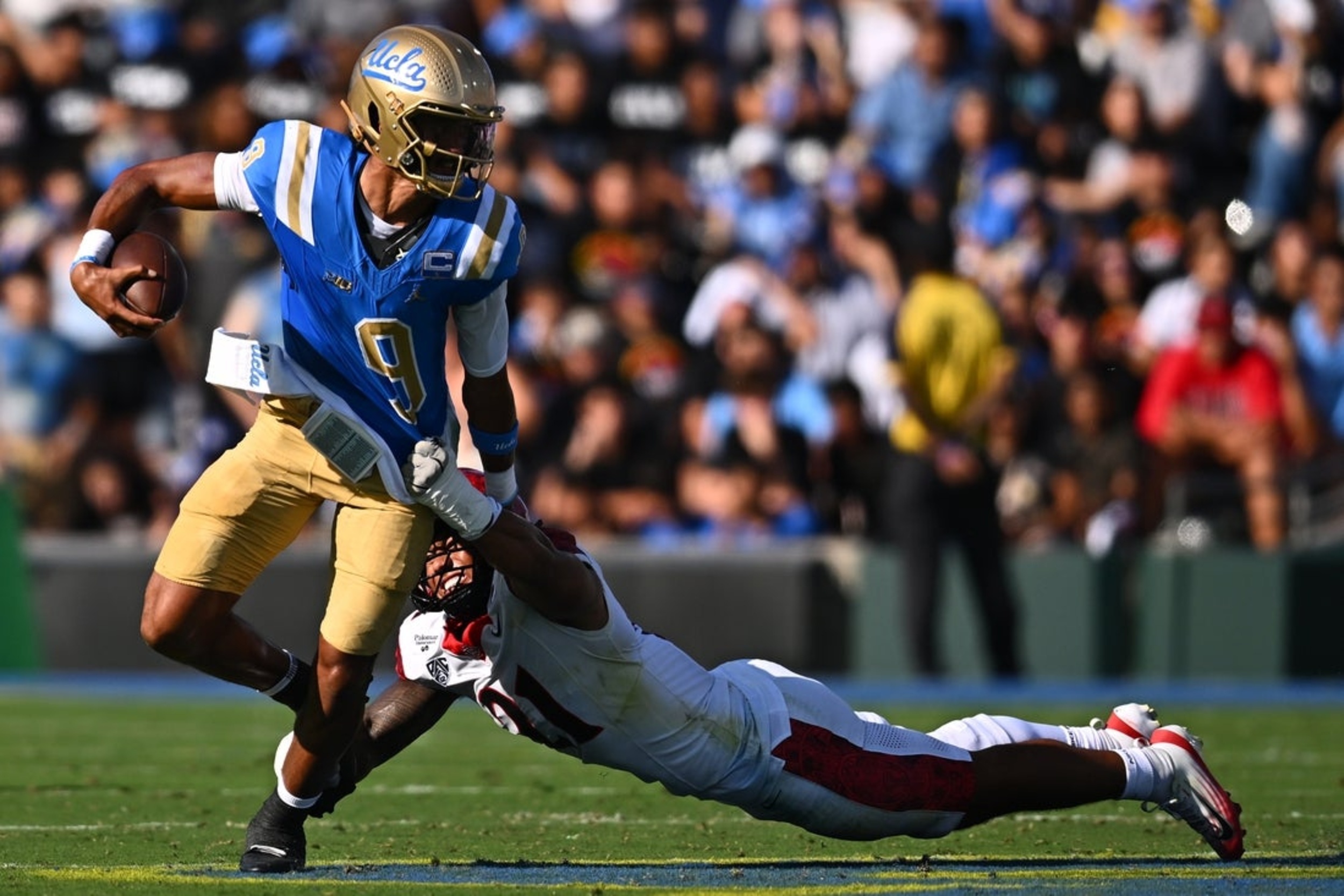 Wayne Knight runs for 3 scores to carry UCLA past San Diego State