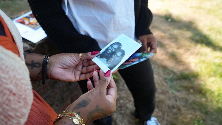 Meena and Minal look at their photos from when they were teenagers