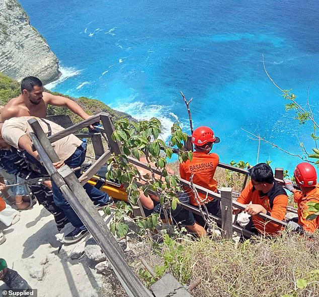 Another tourist had spotted Ms Cronin stranded on the cliff face before she fell a second time, landing on the beach