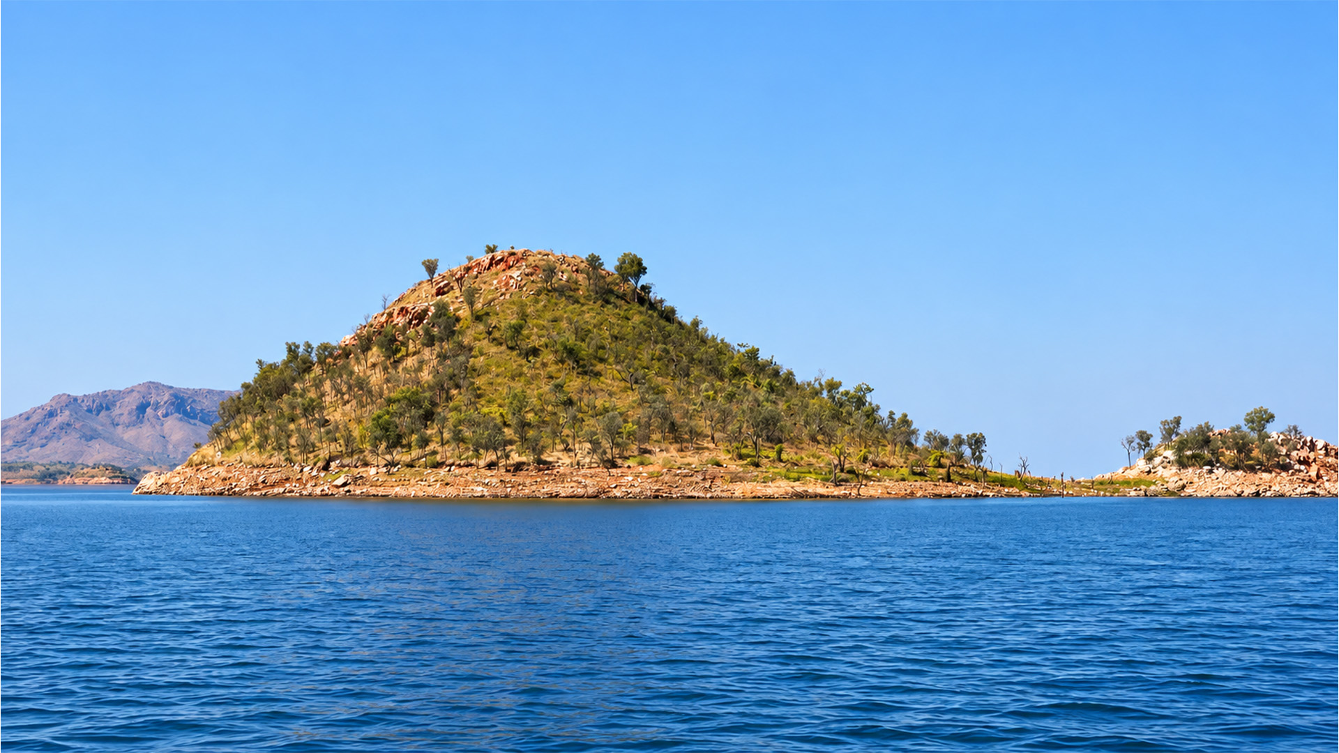 Lake Argyle’s blue water and Kimberley hills