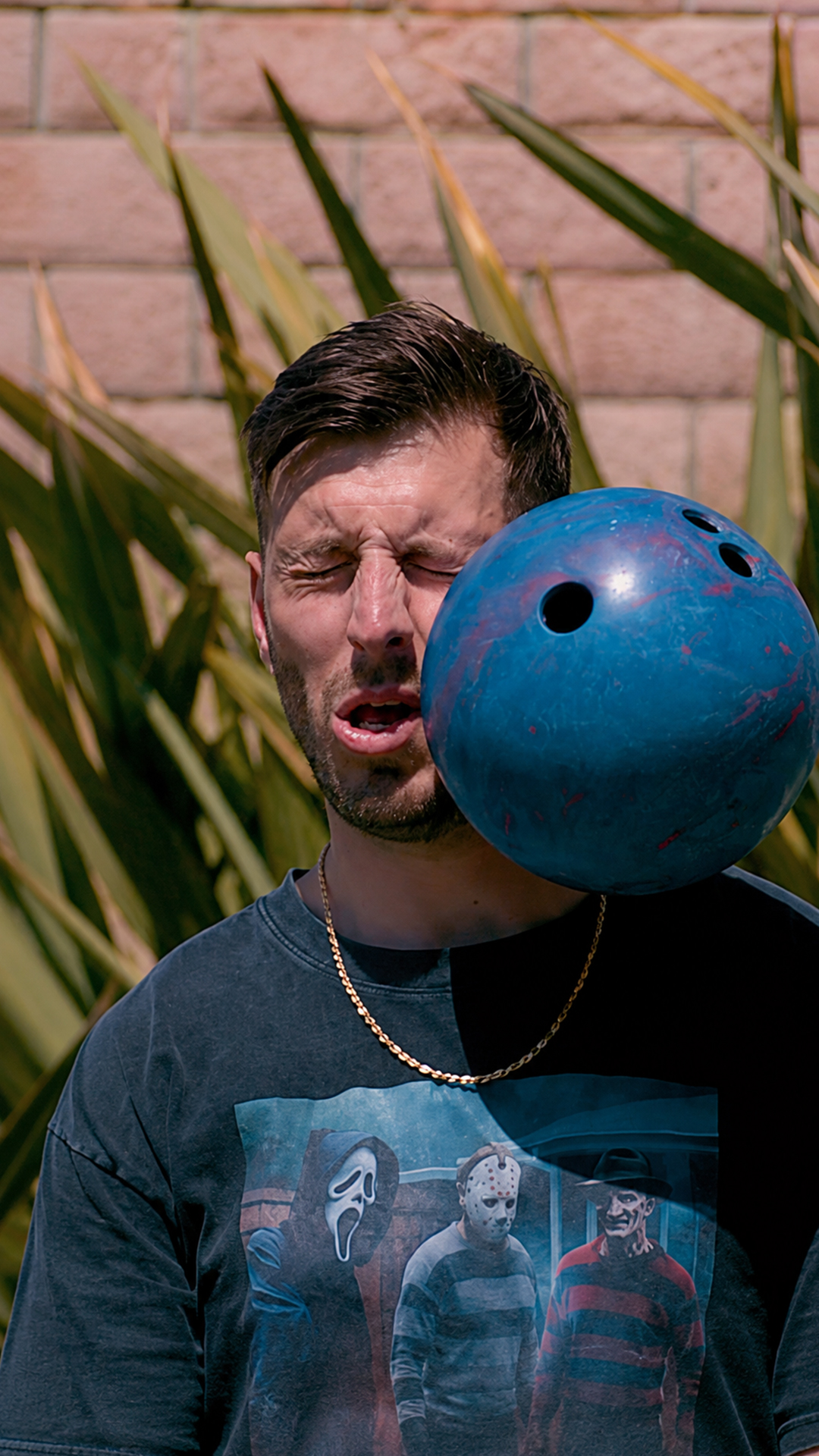 Bowling ball meets face in a painful slow motion viral moment