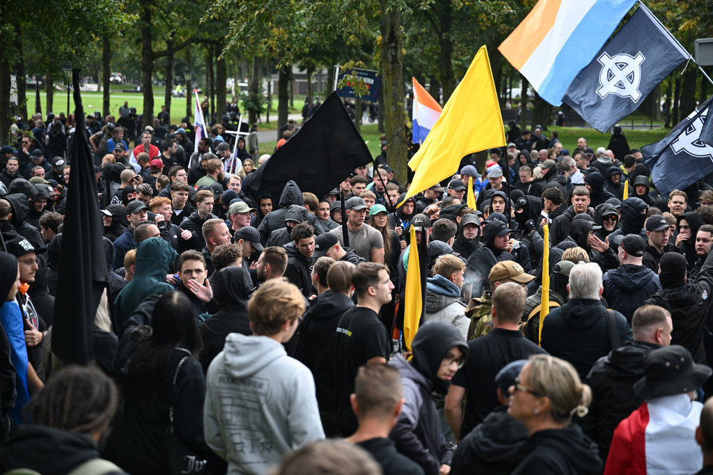 Dutch riot police break up far-right protest in The Hague after ...