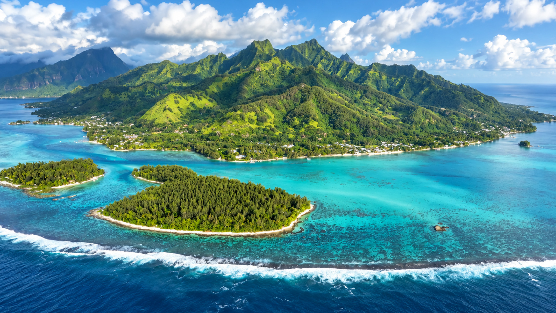 A mountain island protected by a ring of reefs