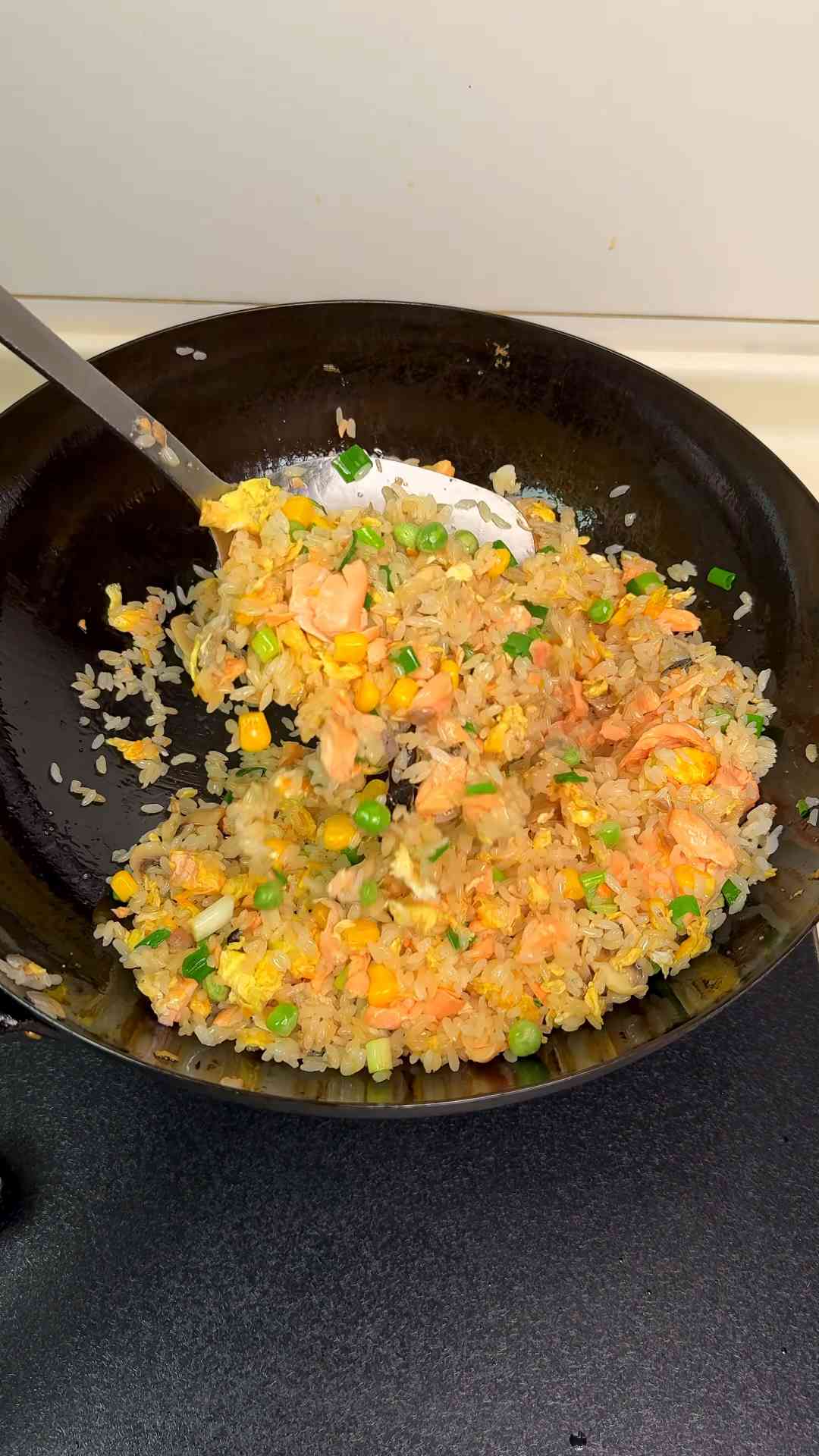 Healthy salmon fried rice with fresh ingredients