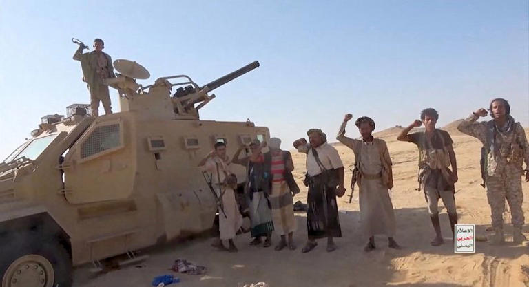 Iran-aligned Houthi fighters pose next to a captured vehicle following what the source described as an attack on Saudi-backed forces in the location given by the source as al Jawf governorate, Yemen, in this screengrab taken from a video released by Houthi Military Media on September 15, 2026. HOUTHI MILITARY MEDIA/Handout via REUTERS