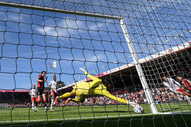 Liverpool's Brazilian goalkeeper #01 Alisson Becker (C) makes a save during the English Premier League football match between Bournemouth and Liverpool at the Vitality Stadium in Bournemouth, southern England on September 20, 2026. (Photo by Glyn KIRK / AFP via Getty Images) / RESTRICTED TO EDITORIAL USE. No use with unauthorized audio, video, data, fixture lists, club/league logos or 'live' services. Online in-match use limited to 120 images. An additional 40 images may be used in extra time. No video emulation. Social media in-match use limited to 120 images. An additional 40 images may be used in extra time. No use in betting publications, games or single club/league/player publications. /