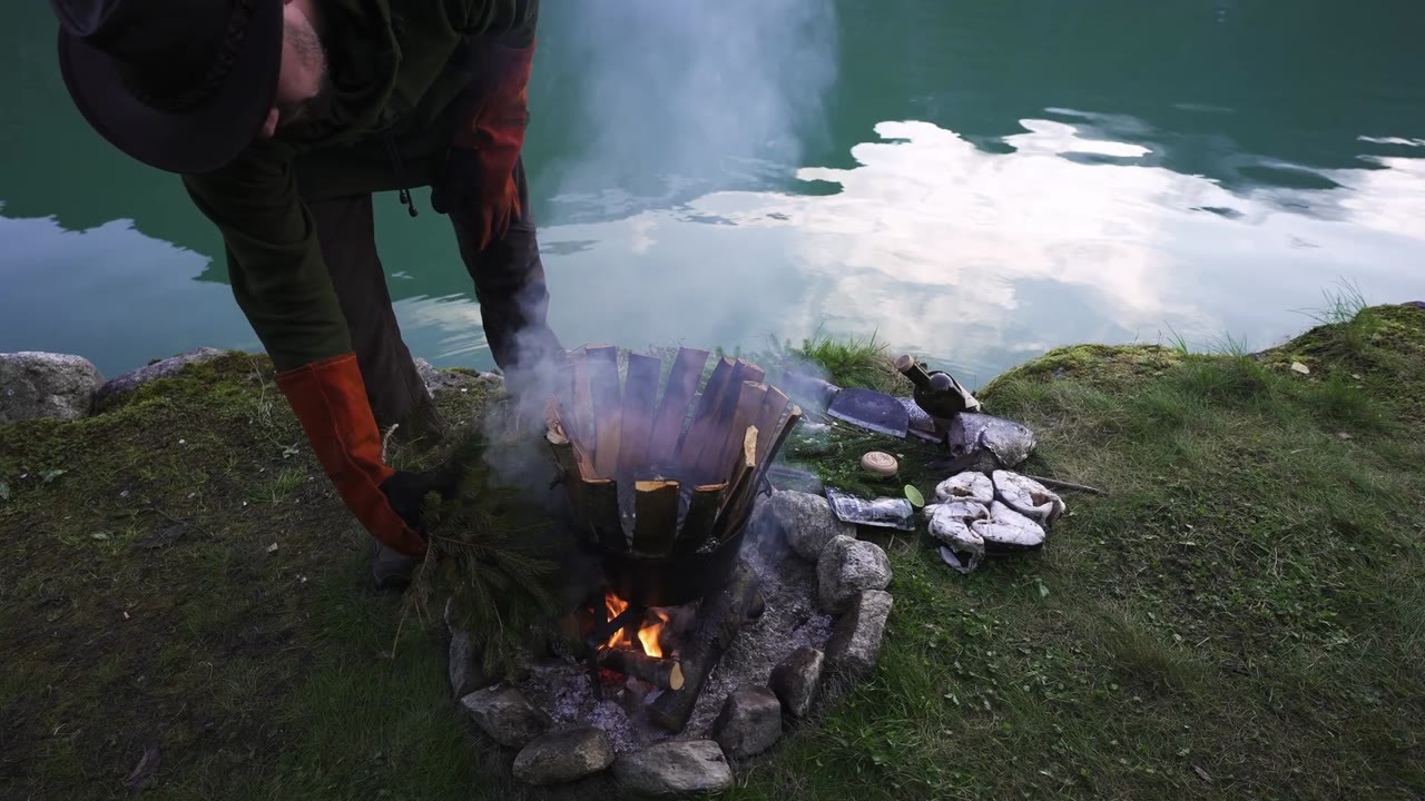 Monster fish steaks cooked in pine steam deep in the wild