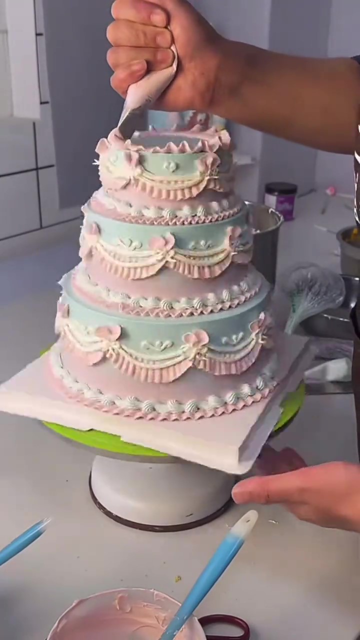 Dreamy pink and mint cake gets an elaborate vintage decorating finish