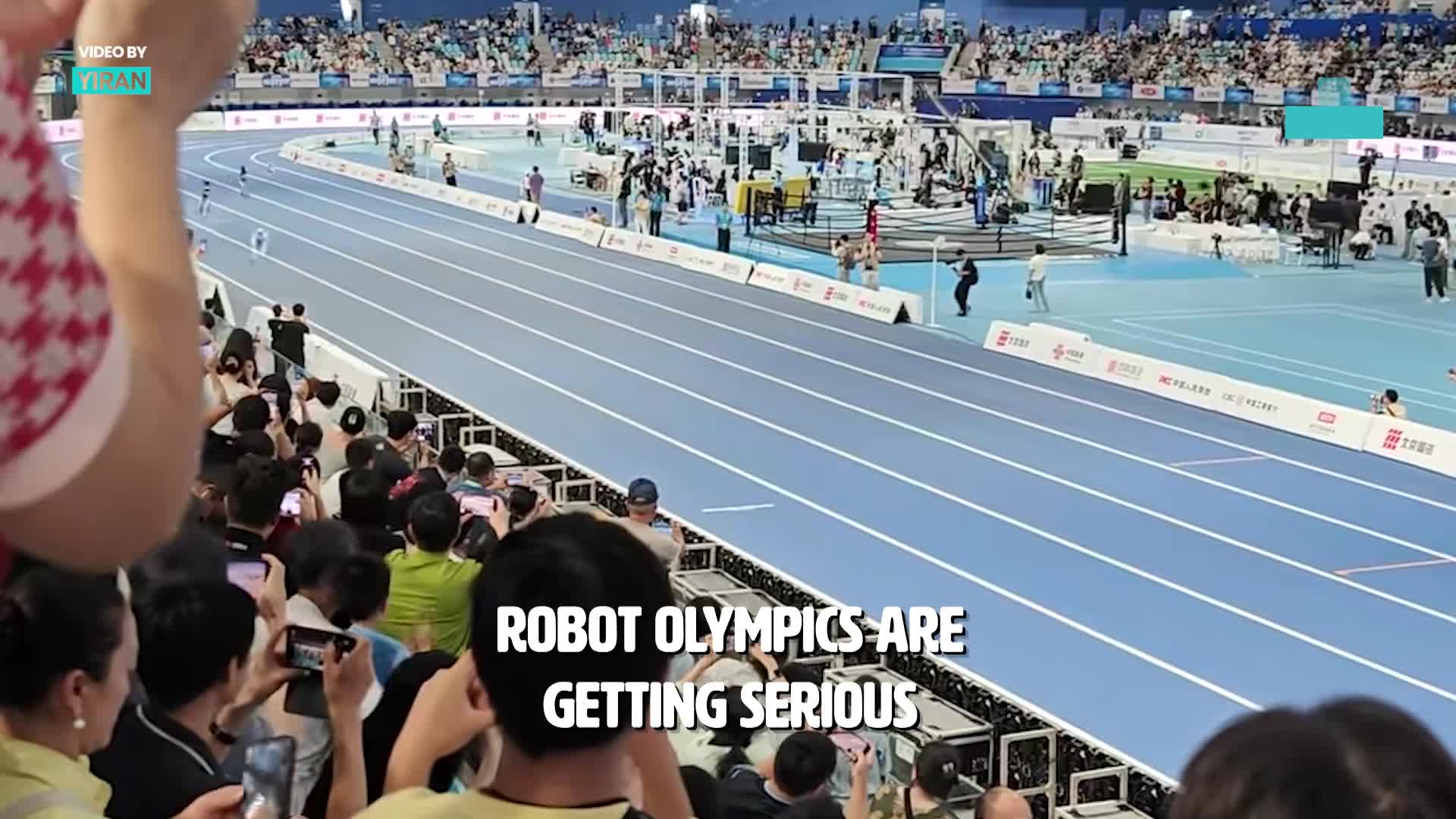 Humanoid robots go head-to-head in futuristic track race