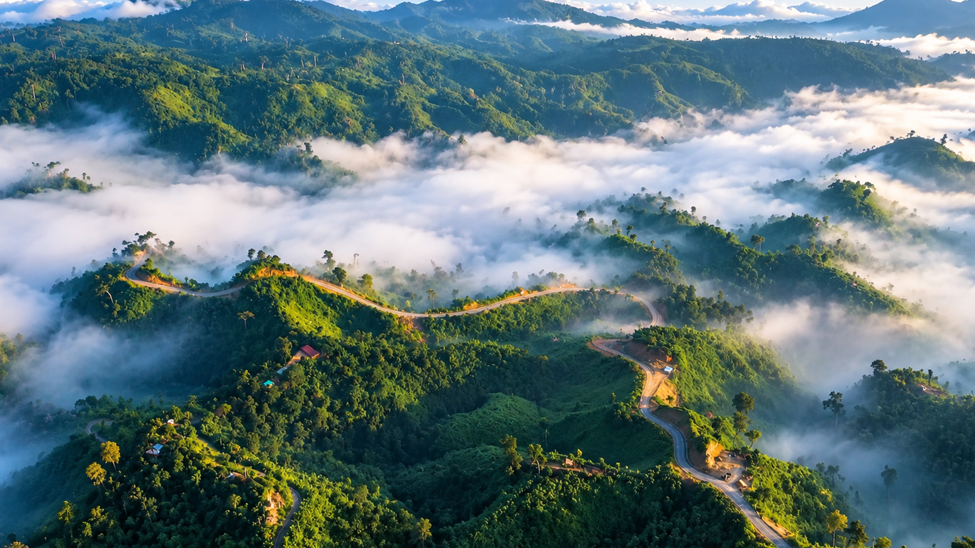 Driving Through Mountains Covered By Thick Clouds