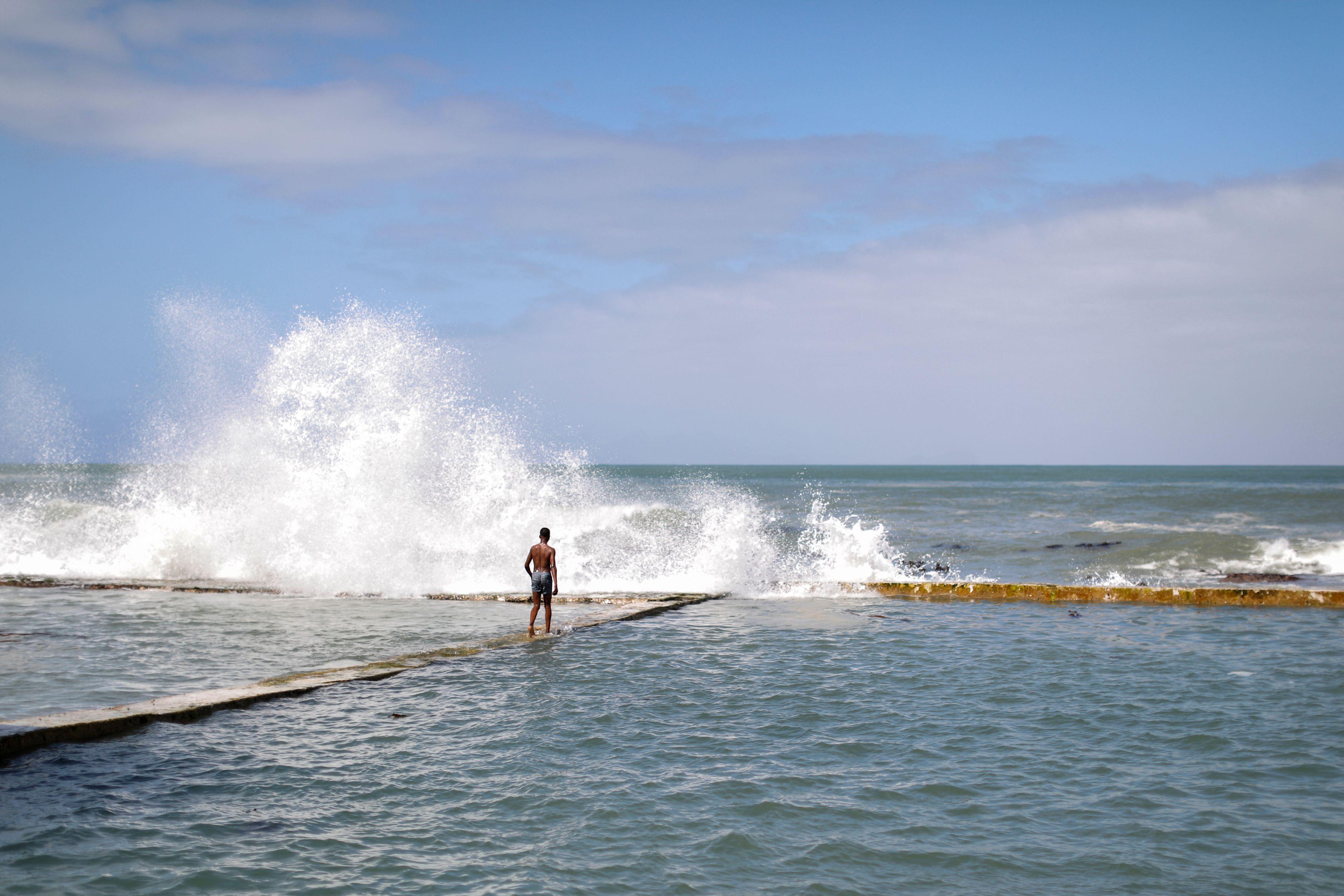 Tourists trapped by high tide while trying to take dramatic beach photo