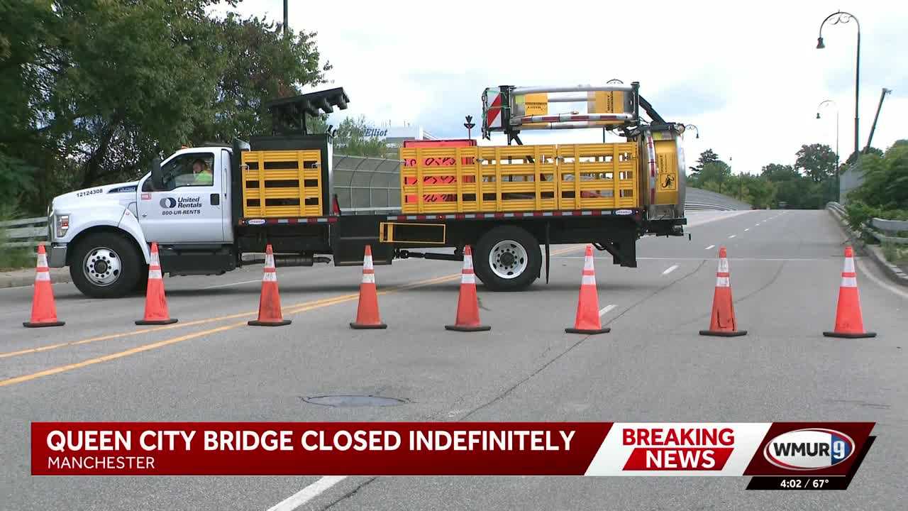 Morning commuters navigate around Queen City Bridge in Manchester following closure