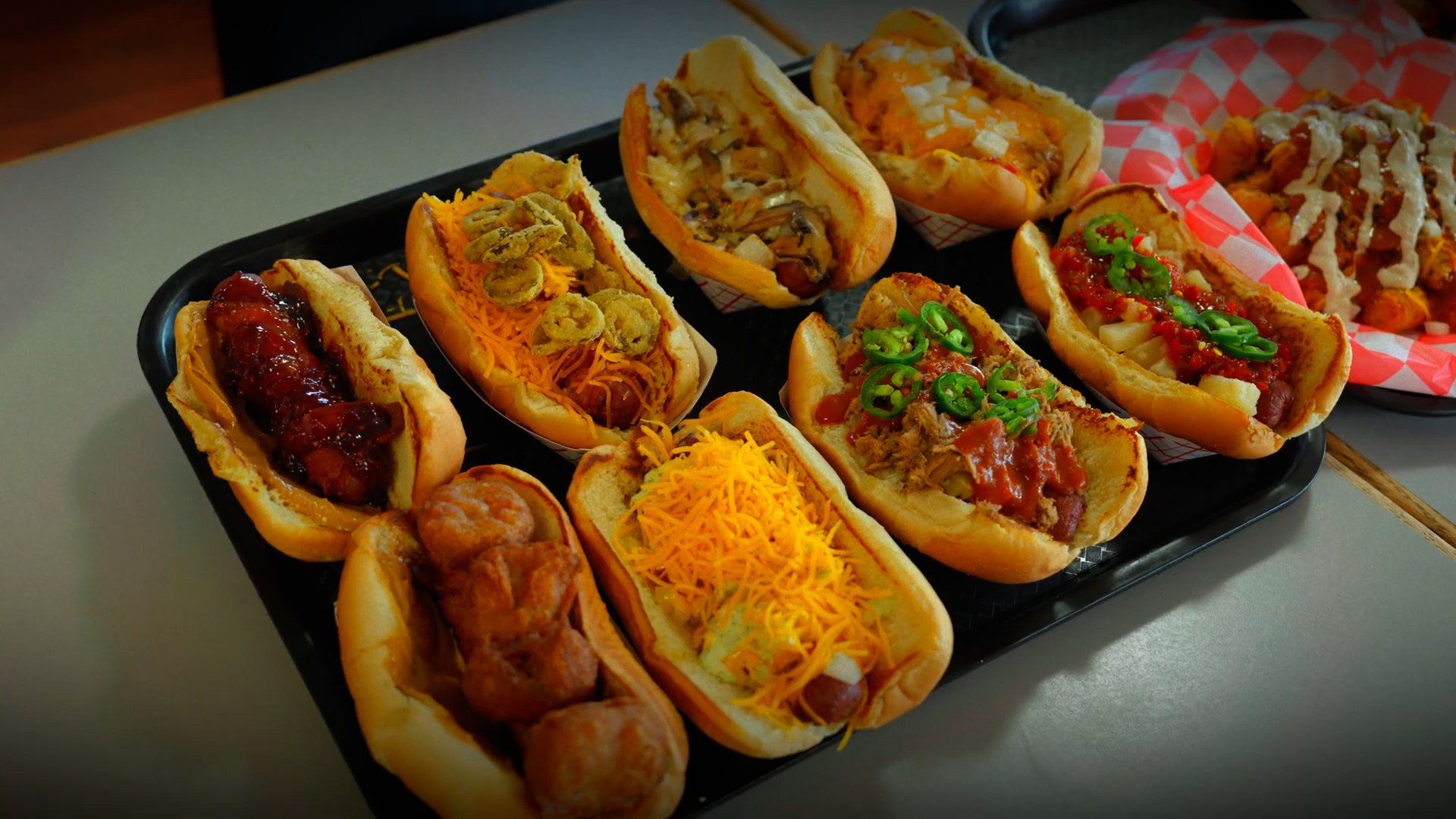 Man attempts 8 specialty hot dogs plus a deep-fried dessert feast