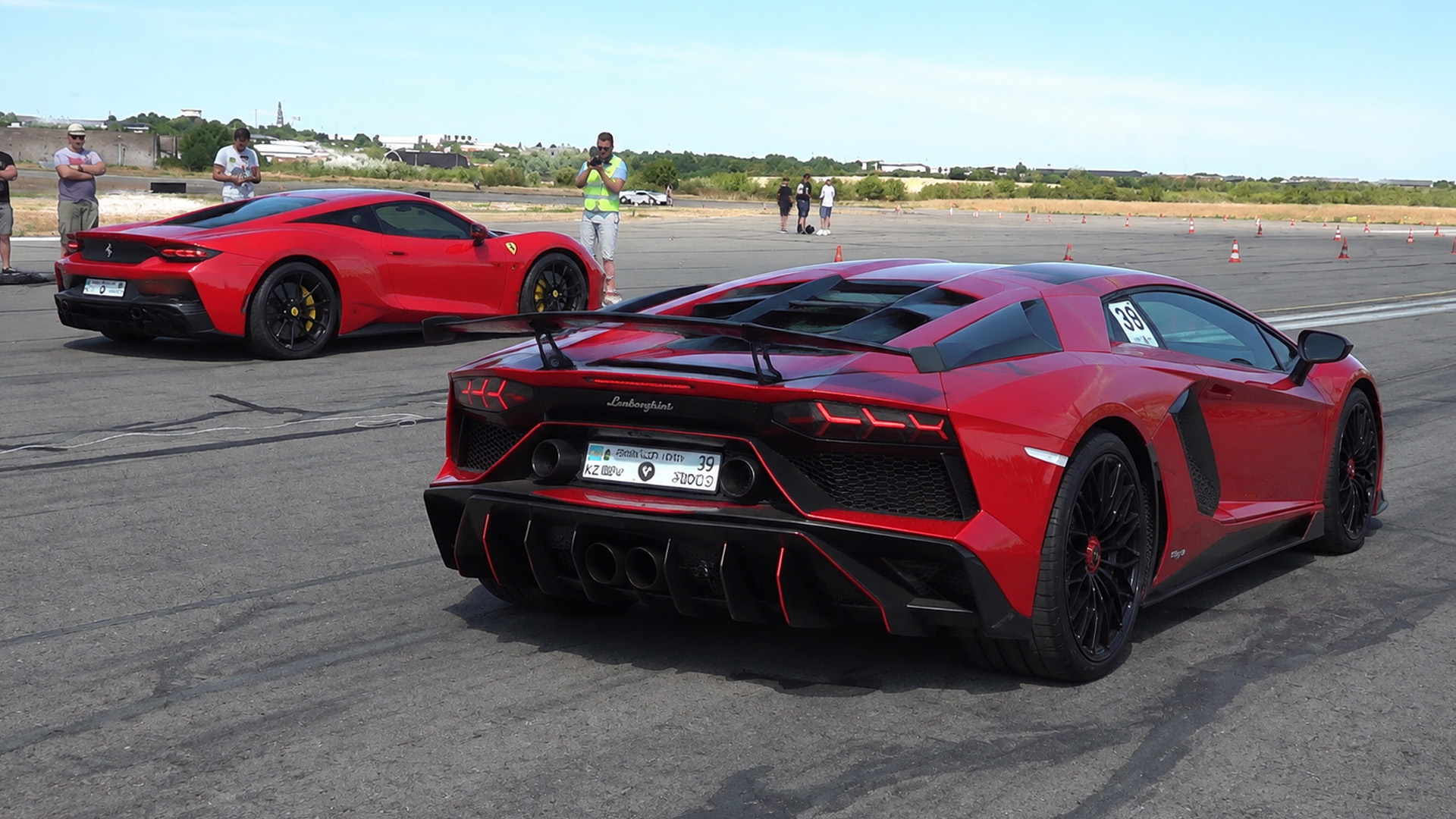 Lamborghini Aventador SV lines up beside a Ferrari