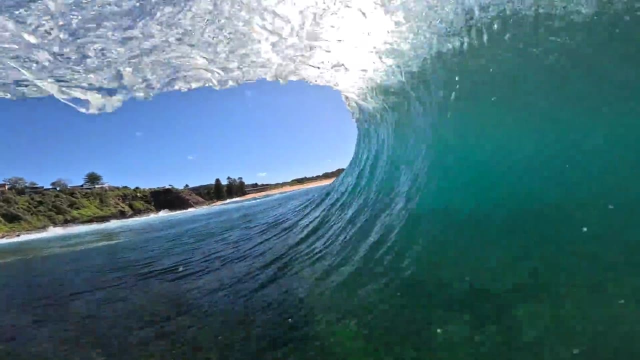 Surfer takes a 5'8 board into fast, hollow waves over a shallow reef