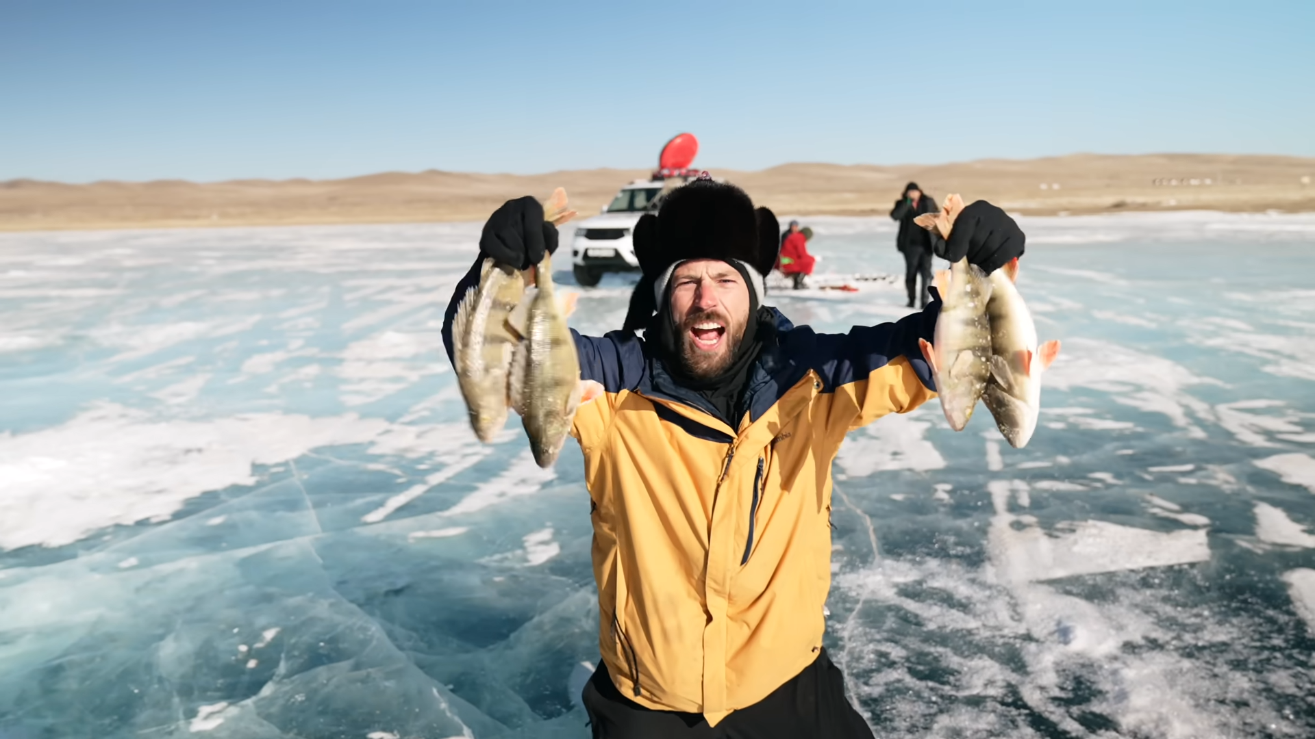 Mongolian fishermen pour 36% vodka during ice fishing before the ...