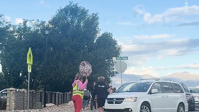 Crossing guard jumps in front of car to save kids