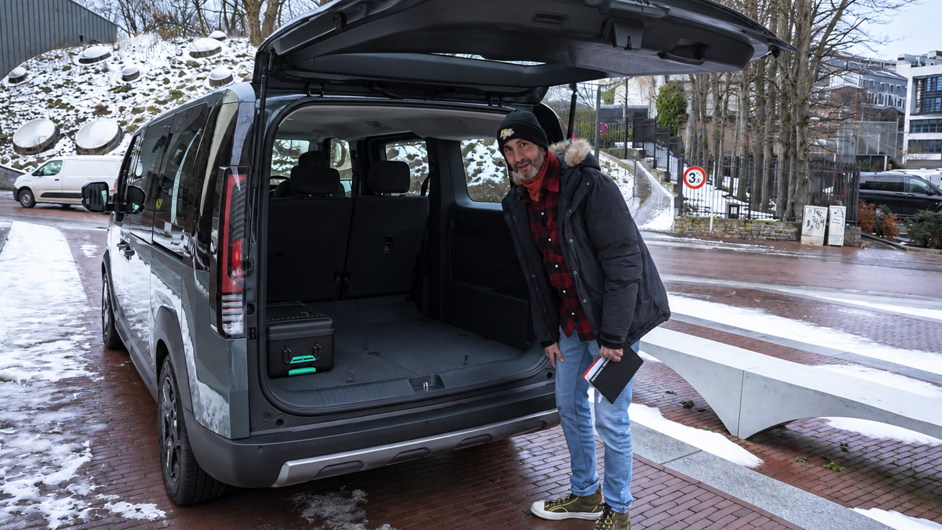 Opening the Kia PV5 rear doors reveals a spacious cabin