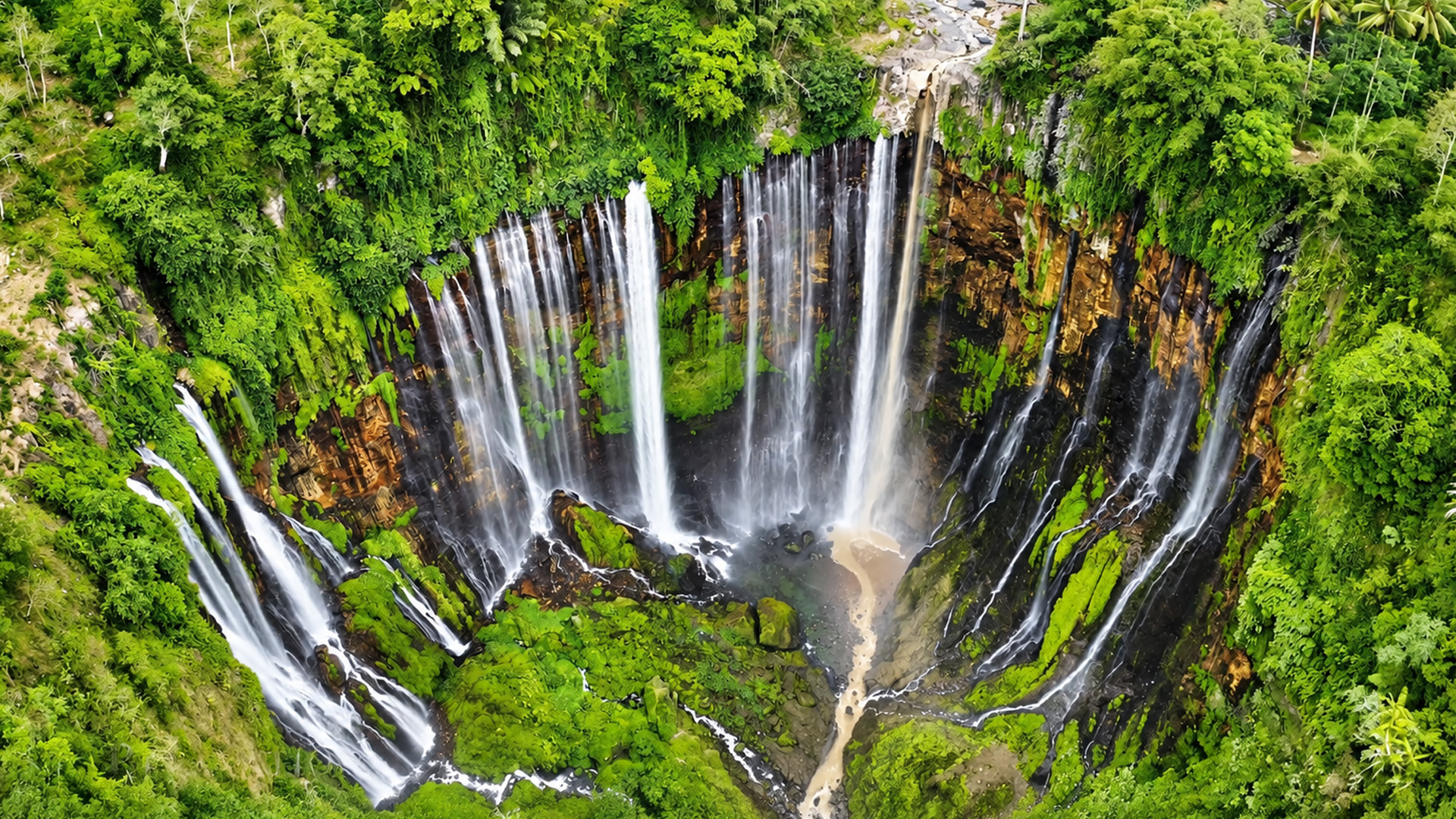 A remote valley filled with multiple waterfalls