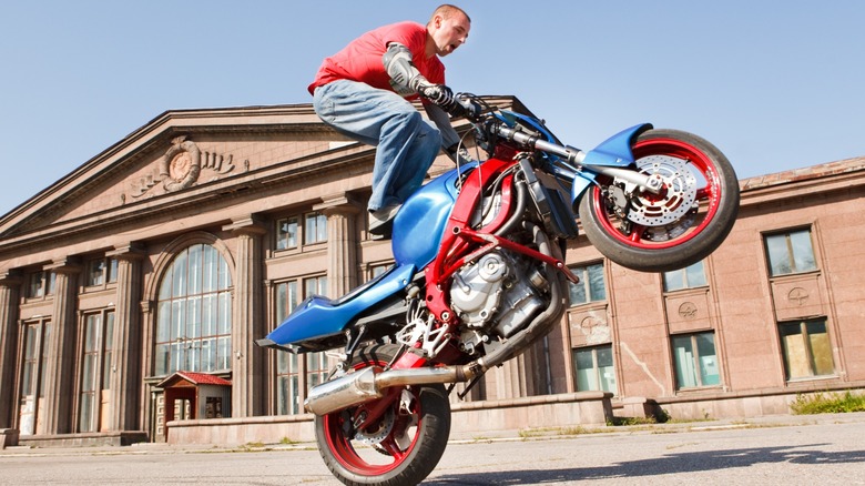 The reason why stunt bikes have dented gas tanks