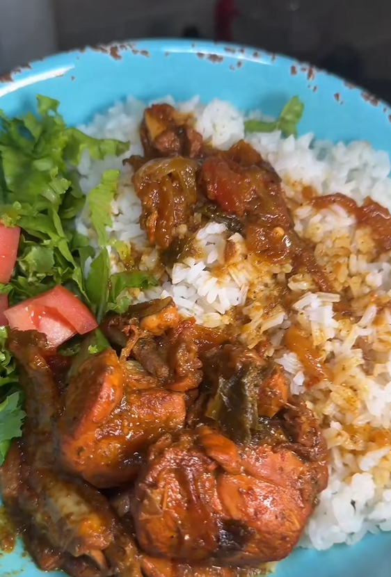 Dominican chicken with flavorful sauce and white rice
