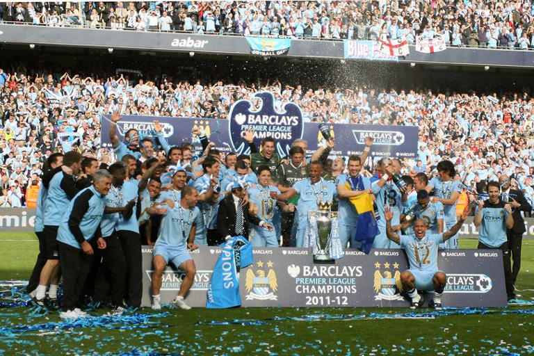 Manchester City celebrate with the Barclays Premier League Trophy