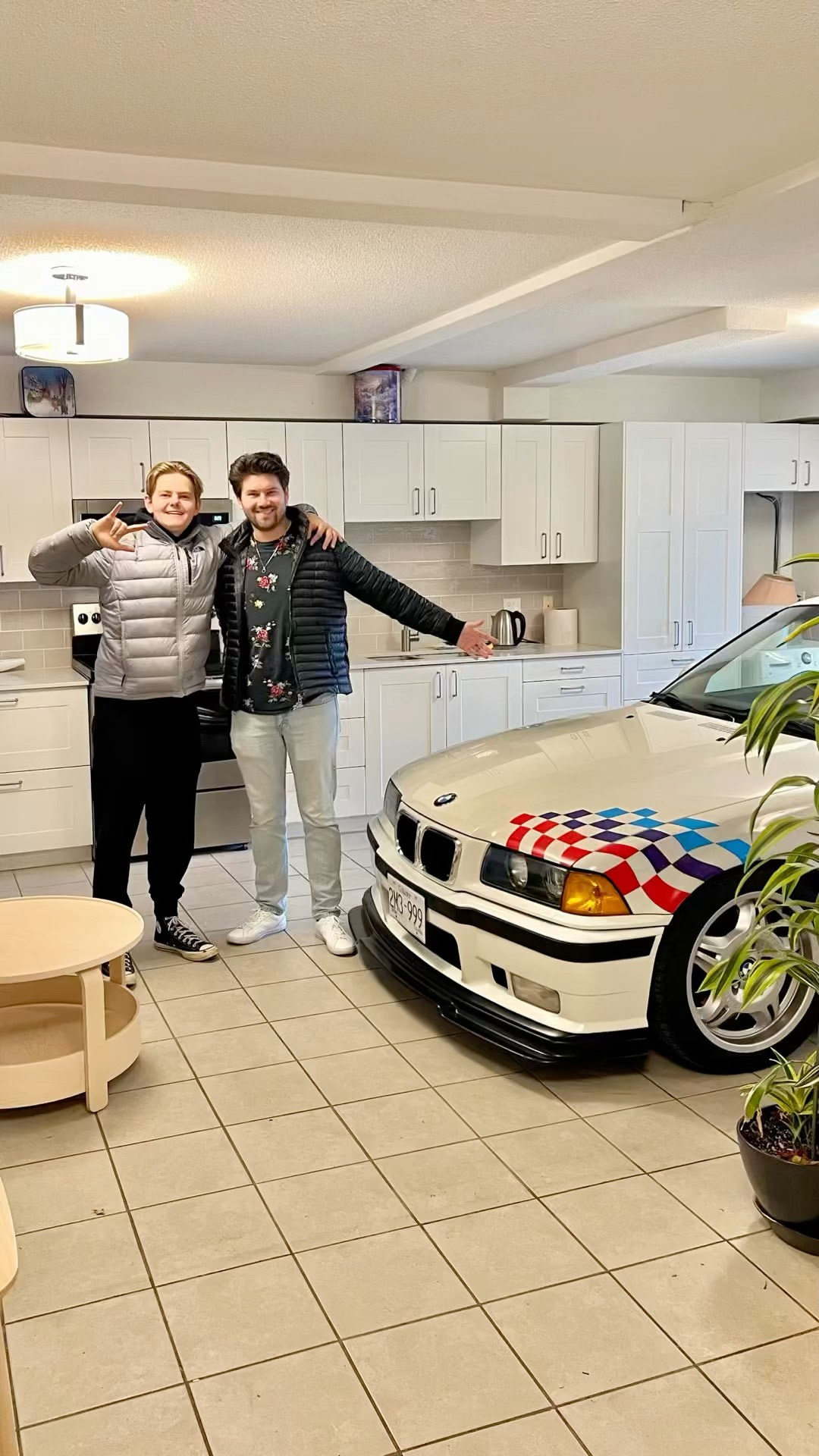 This BMW E30 is parked inside a house