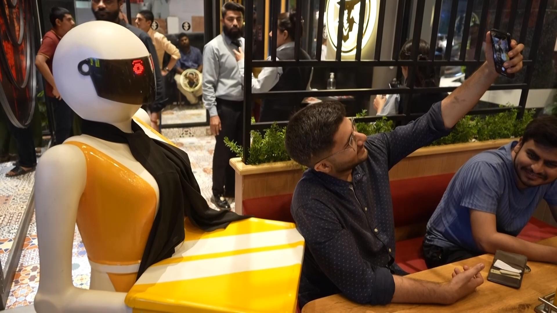 Locally made AI enhanced robots serve customers at Pakistan restaurant