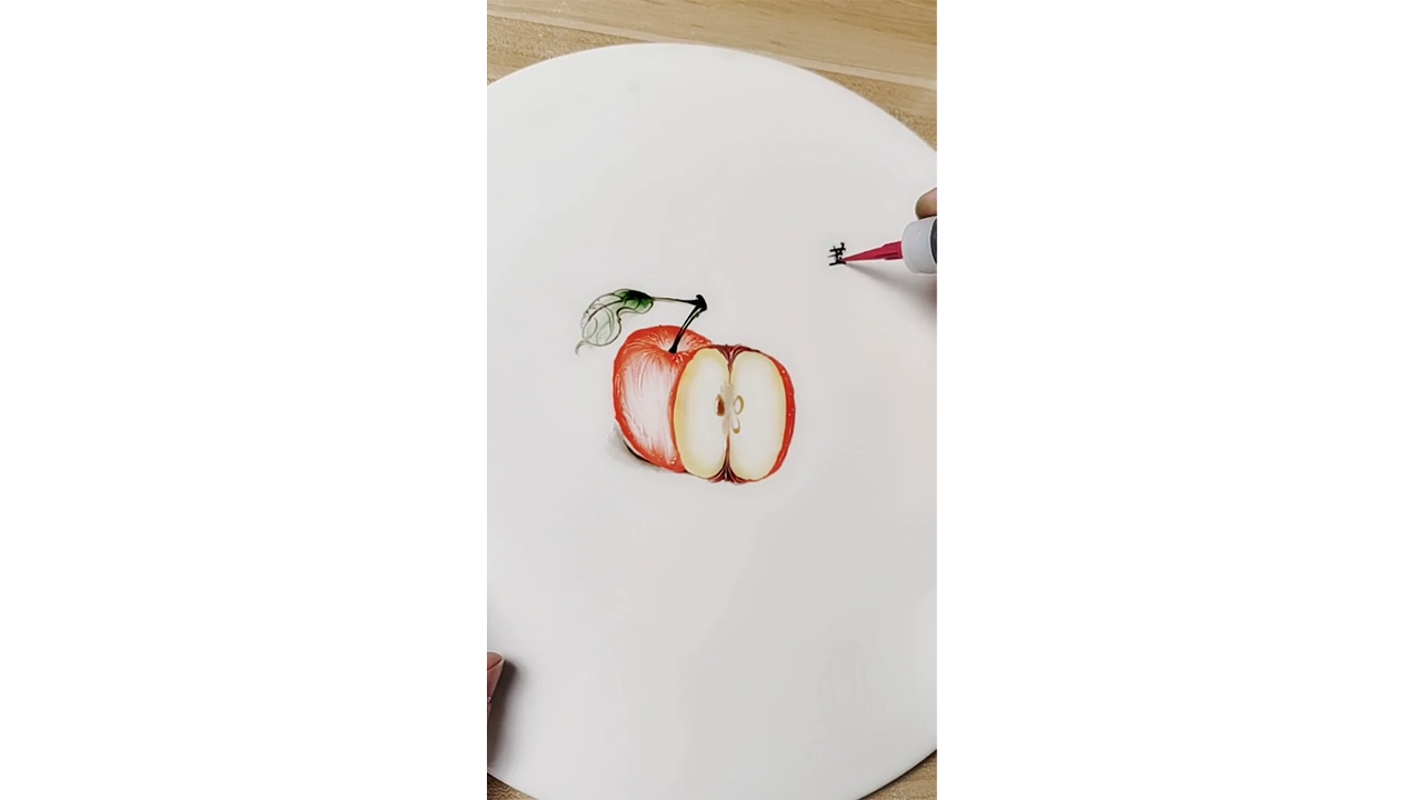 Drawing realistic red apple with ink creating fresh fruit illustration