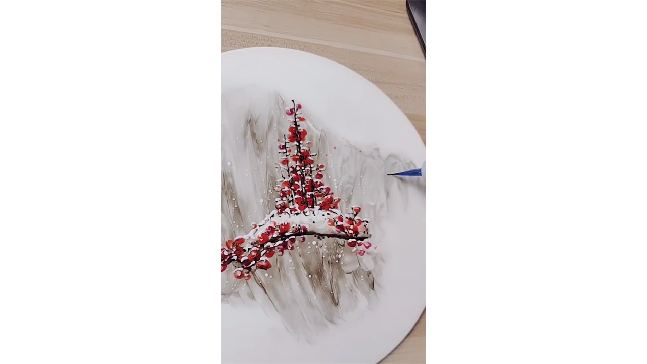 Painting snow covered red blossoms with ink creating peaceful winter ...