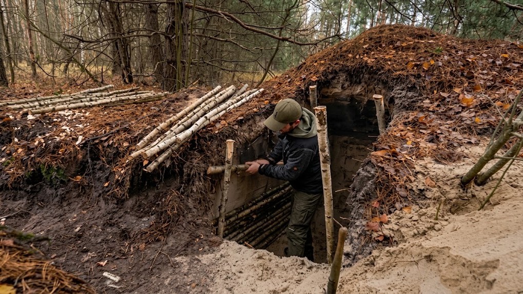 Constructing a cozy dugout shelter in the wilderness