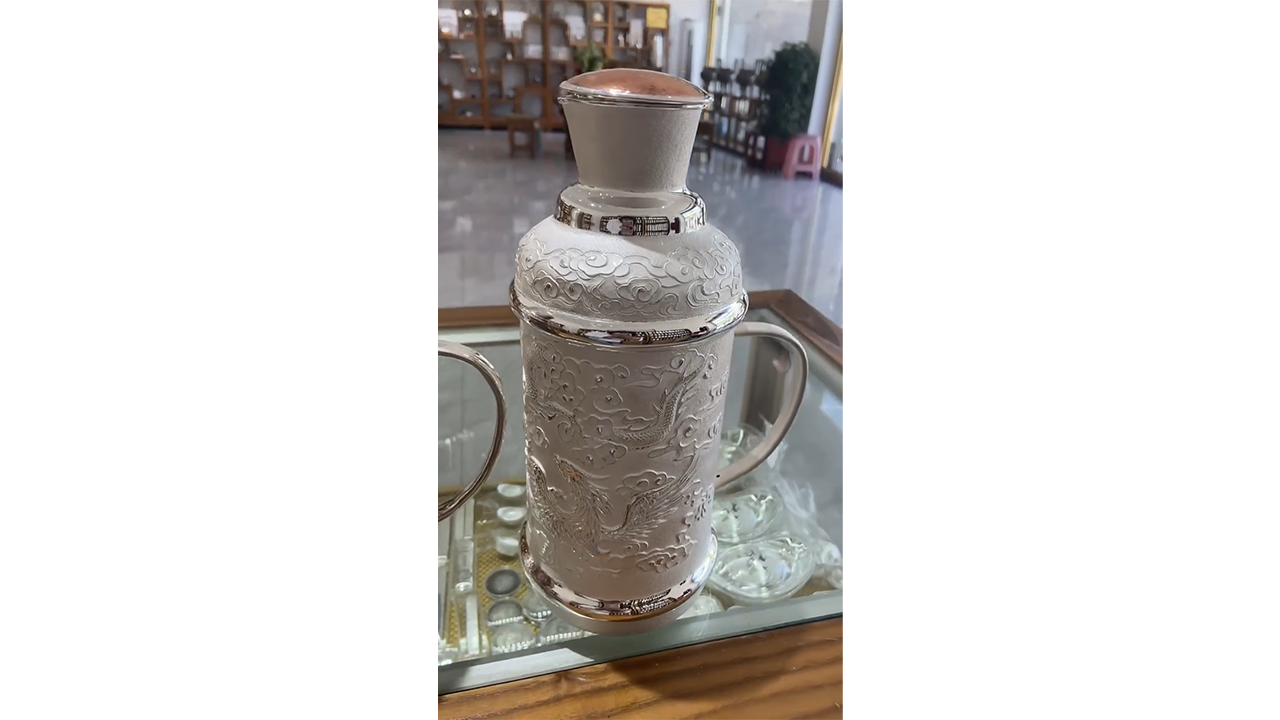 Crafting textured silver into lidded bottle producing detailed ...