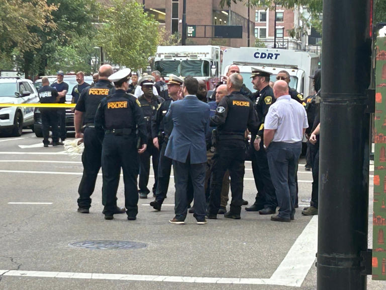 9 arrested after activists chain themselves to Kroger headquarters