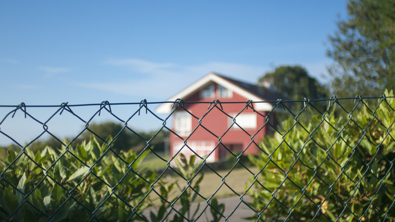 Swap the chain-link fence for a rustic flea market find that's unique
