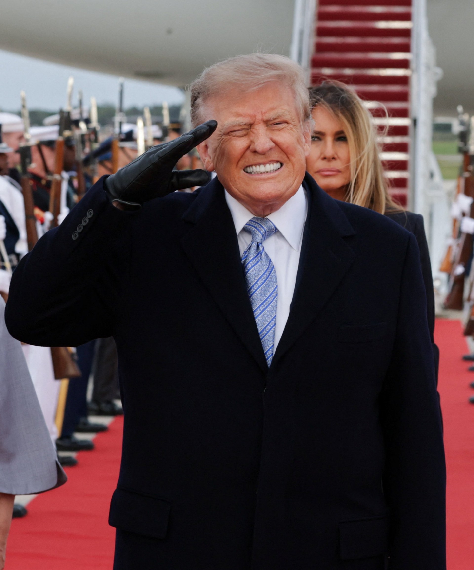 Trump winces after fighter jets roar above him during military flyover