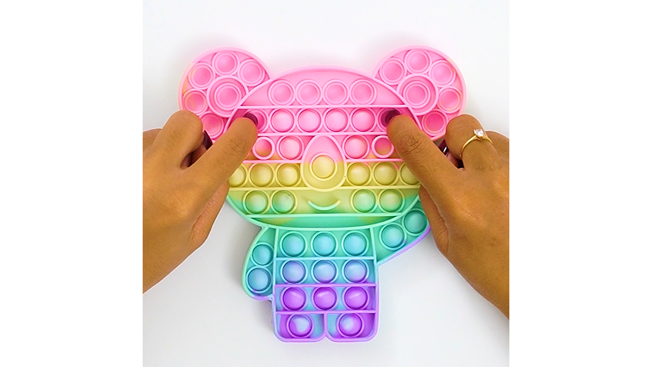 Pastel koala bubble pops create a soft satisfying rhythm