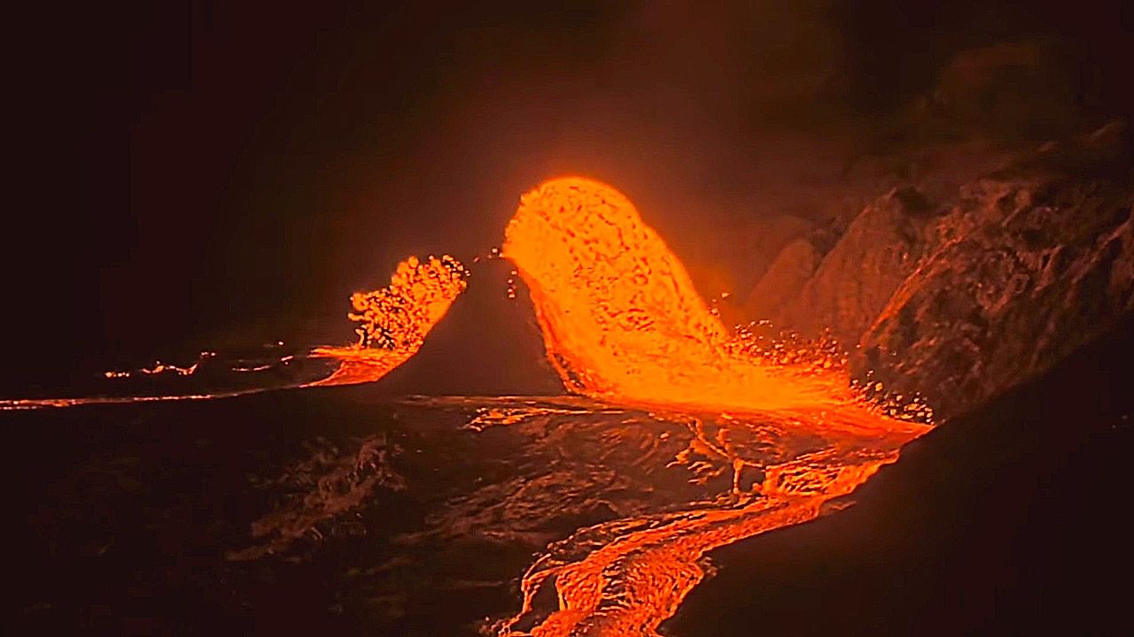 Kilauea volcano lava glows in nighttime overflow
