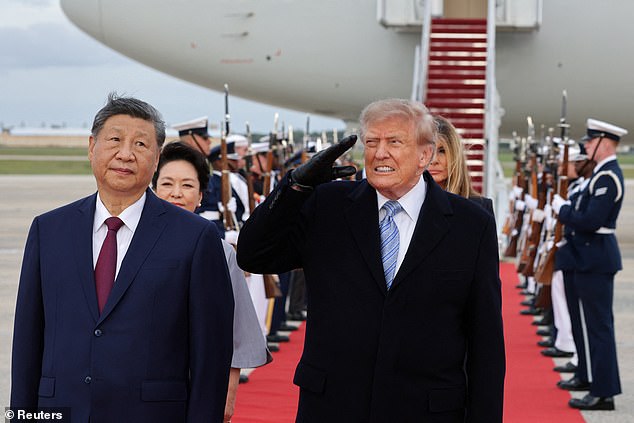 Trump visibly winces during stone-faced Xi's red carpet welcome